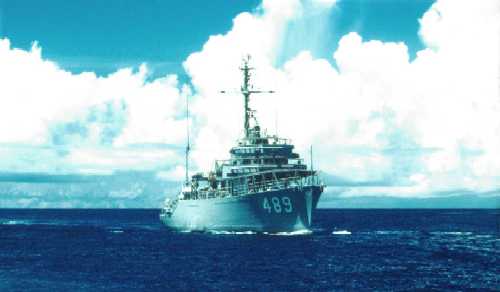I took this slide of GALLANT on a glorious afternoon in September 1957. We were on our way home from MINDIV 73's first WESPAC deployment and were between Midway Island and Pearl Harbor. MINDIV 73 at that time was comprised of ACME, CONQUEST, ESTEEM, GALLANT, and PLEDGE. Fuel bladders were not yet in the fleet, so we carried deck loads of diesel in 52 gallon drums. On the way over, one of the ships ran out of fuel and had to be towed into Tokyo Bay.