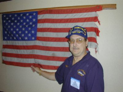 The flag in the background was flown on the USS Conflict during Operation Market Time<br>and was displayed at the 2002 KickOff reunion courtesy of John Riley